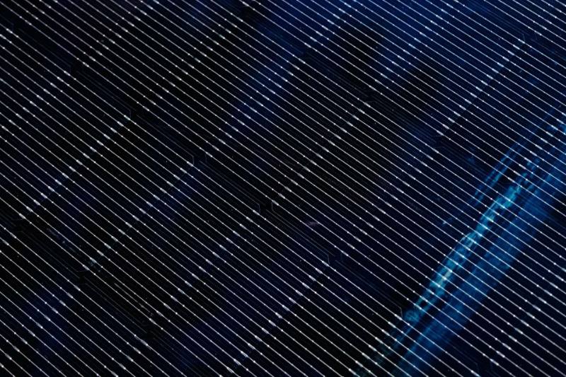 Close-up detail of solar panel cells freshly installed on a roof